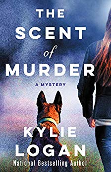 The book cover of The Scent of Murder by Kylie Logan shows the title, author, and the back view of a dog and a woman standing beside each other. Mystery. Book Review. 
